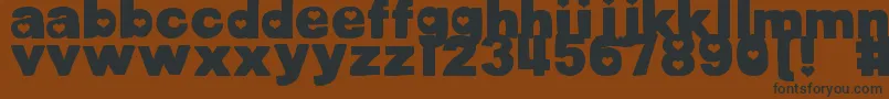 DjbCutoutsHearts Font – Black Fonts on Brown Background