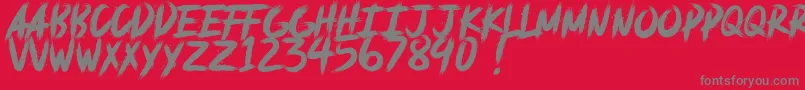 deadpack DEMO-fontti – harmaat kirjasimet punaisella taustalla