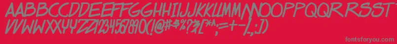 フォントdealspinner tbs bold – 赤い背景に灰色の文字