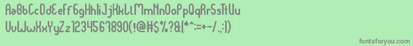 フォントDear Baby – 緑の背景に灰色の文字