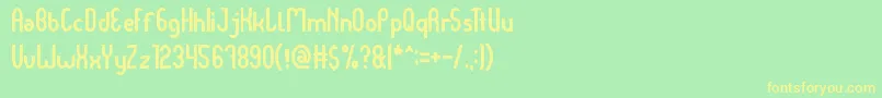 フォントDear Baby – 黄色の文字が緑の背景にあります