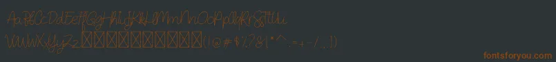 Шрифт DearAudrey Script – коричневые шрифты на чёрном фоне