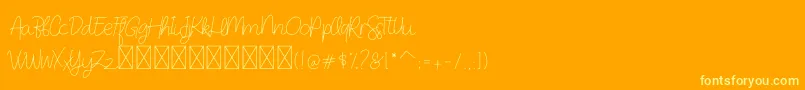 DearAudrey Script-Schriftart – Gelbe Schriften auf orangefarbenem Hintergrund