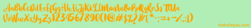 Dearday Script-Schriftart – Orangefarbene Schriften auf grünem Hintergrund