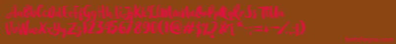 Dearday Script-Schriftart – Rote Schriften auf braunem Hintergrund