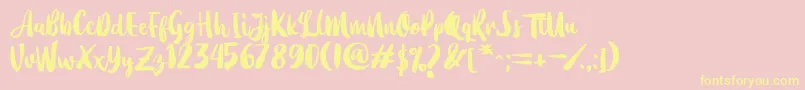 フォントDearday Script – 黄色のフォント、ピンクの背景
