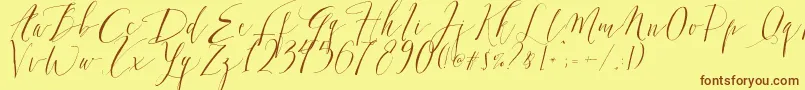 フォントDearlyScript – 茶色の文字が黄色の背景にあります。