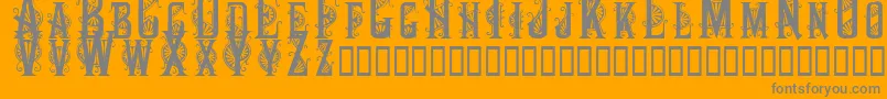 Decocaps-Schriftart – Graue Schriften auf orangefarbenem Hintergrund