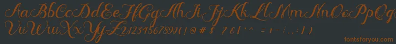 Шрифт Delima – коричневые шрифты на чёрном фоне