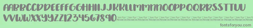 Delirious Demo Font – Gray Fonts on Green Background