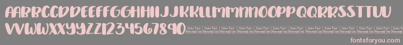 Delirious Demo Font – Pink Fonts on Gray Background