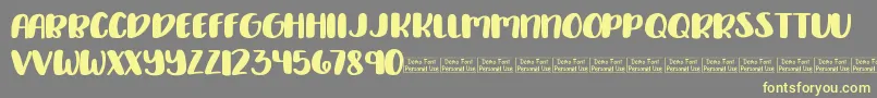 Delirious Demo Font – Yellow Fonts on Gray Background