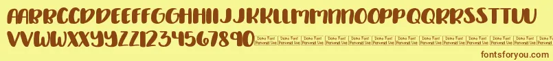 Delirious Demo-Schriftart – Braune Schriften auf gelbem Hintergrund