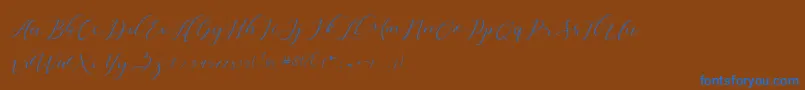 Dellisya-Schriftart – Blaue Schriften auf braunem Hintergrund