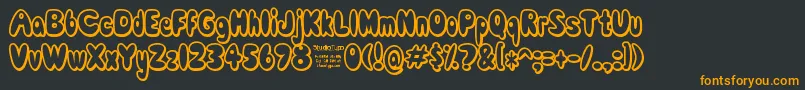 ComicWhiteRabbitDemo-fontti – oranssit fontit mustalla taustalla
