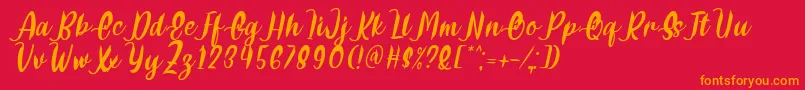 Delumba Italic Font by 7NTypes Font – Orange Fonts on Red Background