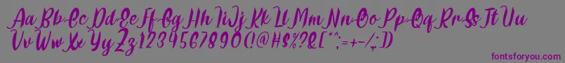 Delumba Italic Font by 7NTypes Font – Purple Fonts on Gray Background