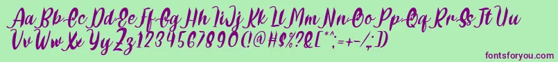Delumba Italic Font by 7NTypes Font – Purple Fonts on Green Background