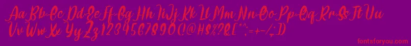 Delumba Italic Font by 7NTypes Font – Red Fonts on Purple Background