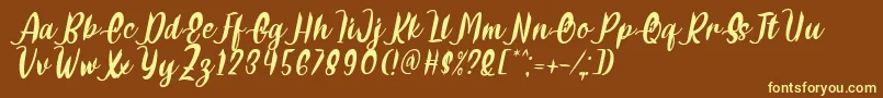 Delumba Italic Font by 7NTypes Font – Yellow Fonts on Brown Background