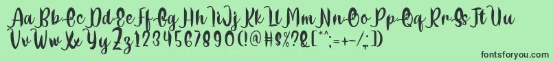 Delumba Regular Font by 7NTypes Font – Black Fonts on Green Background