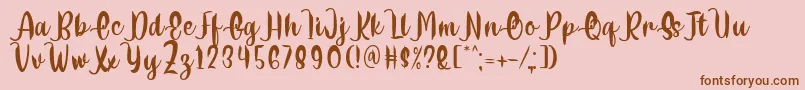 Delumba Regular Font by 7NTypes-Schriftart – Braune Schriften auf rosa Hintergrund