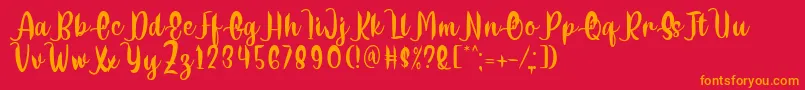 Delumba Regular Font by 7NTypes Font – Orange Fonts on Red Background
