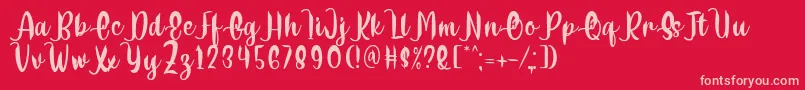 Fonte Delumba Regular Font by 7NTypes – fontes rosa em um fundo vermelho