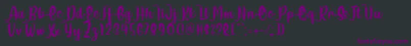 Delumba Regular Font by 7NTypes Font – Purple Fonts on Black Background