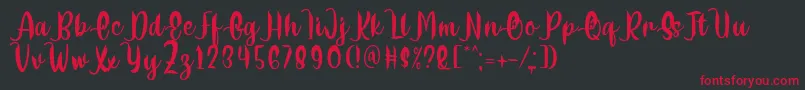 Шрифт Delumba Regular Font by 7NTypes – красные шрифты на чёрном фоне