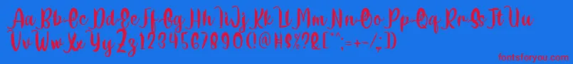 Delumba Regular Font by 7NTypes Font – Red Fonts on Blue Background