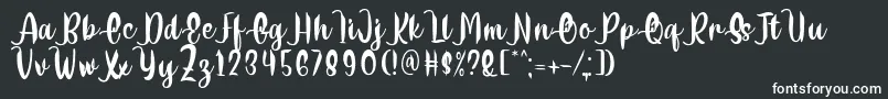 Delumba Regular Font by 7NTypes Font – White Fonts on Black Background