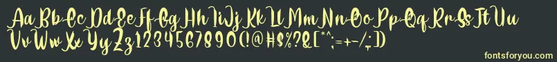 Delumba Regular Font by 7NTypes-Schriftart – Gelbe Schriften auf schwarzem Hintergrund