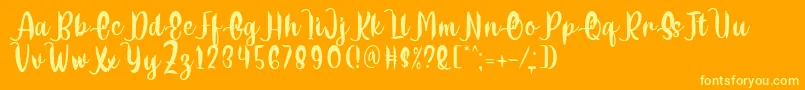Delumba Regular Font by 7NTypes Font – Yellow Fonts on Orange Background