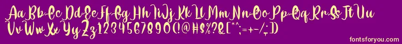 Шрифт Delumba Regular Font by 7NTypes – жёлтые шрифты на фиолетовом фоне