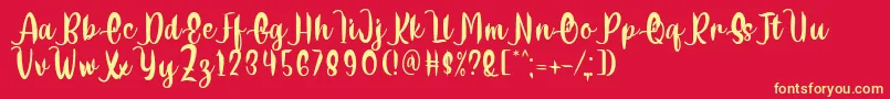 Fonte Delumba Regular Font by 7NTypes – fontes amarelas em um fundo vermelho