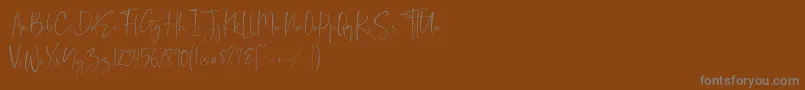 Шрифт Demo Balnes – серые шрифты на коричневом фоне