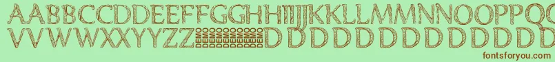 Denka Demo-fontti – ruskeat fontit vihreällä taustalla