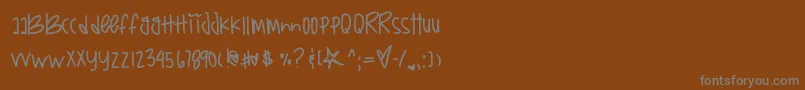 フォントBoxysreturn – 茶色の背景に灰色の文字