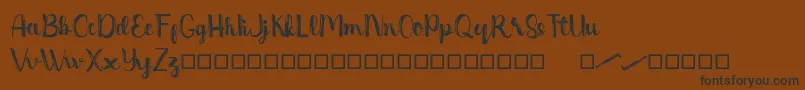 Dentanx Font – Black Fonts on Brown Background