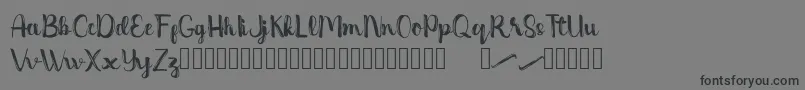 Dentanx Font – Black Fonts on Gray Background