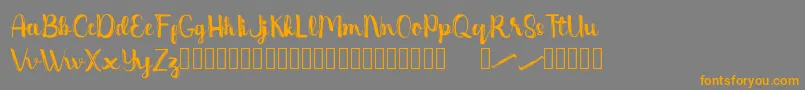 Dentanx-Schriftart – Orangefarbene Schriften auf grauem Hintergrund