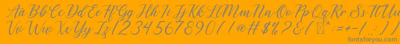 DerickChetty-Schriftart – Graue Schriften auf orangefarbenem Hintergrund