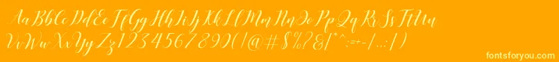 Desyanti Font – Yellow Fonts on Orange Background