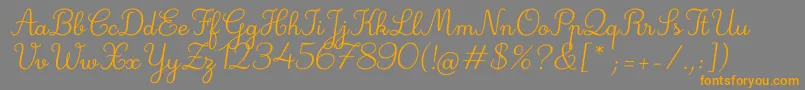 フォントDeuxieme Rang Italic – オレンジの文字は灰色の背景にあります。