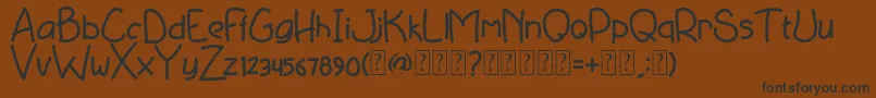 Deviato free-Schriftart – Schwarze Schriften auf braunem Hintergrund