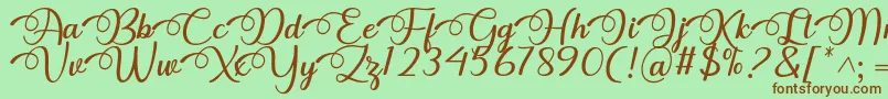 フォントDhitha Font by 7NTypes – 緑の背景に茶色のフォント