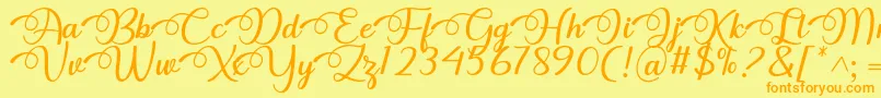 フォントDhitha Font by 7NTypes – オレンジの文字が黄色の背景にあります。