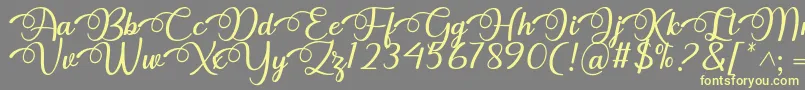 Dhitha Font by 7NTypes-fontti – keltaiset fontit harmaalla taustalla