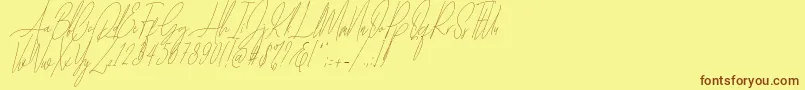 Czcionka Diamante Signature Italic   – brązowe czcionki na żółtym tle